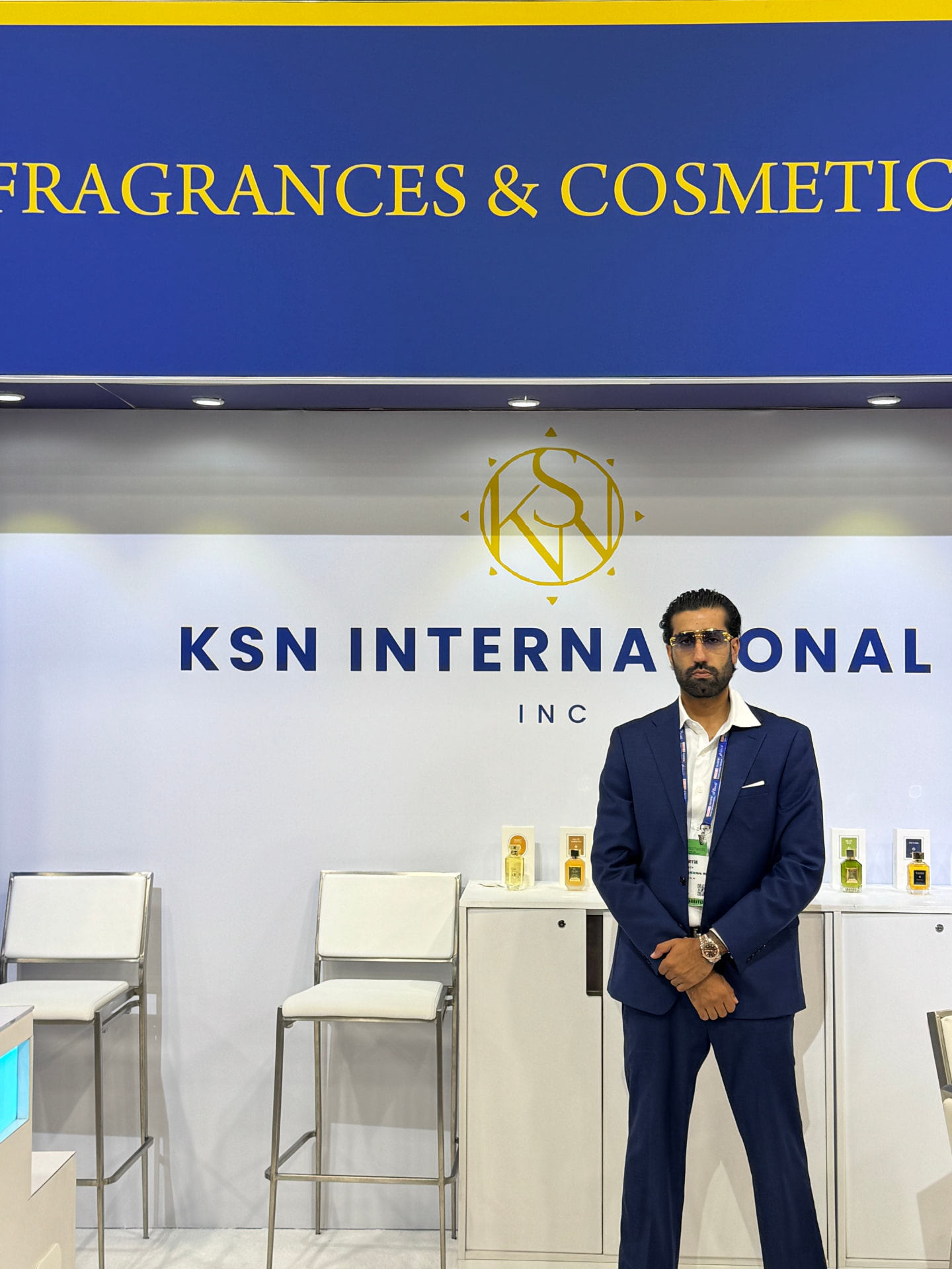 KSN International Inc booth signage with perfume bottles on display